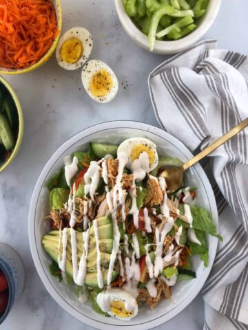 buffalo chicken salad with ranch drizzled on top