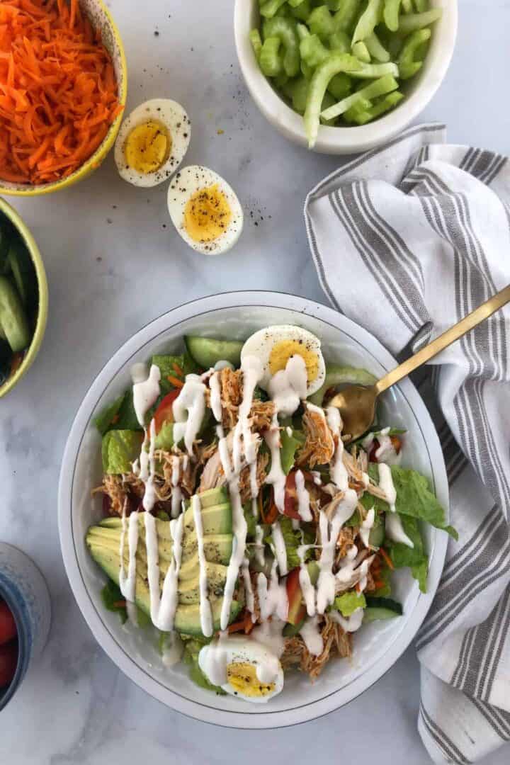 buffalo chicken salad with ranch drizzled on top