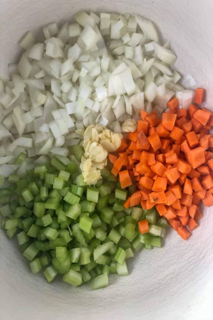 carrots celery onions and garlic in pot