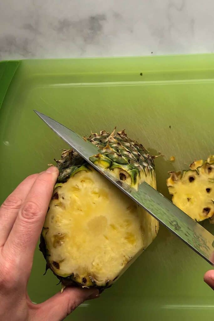 peeling and cutting pineapple