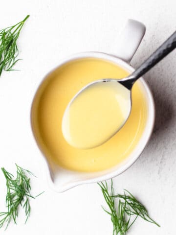 Overhead photo of hollandaise sauce in a small bowl.