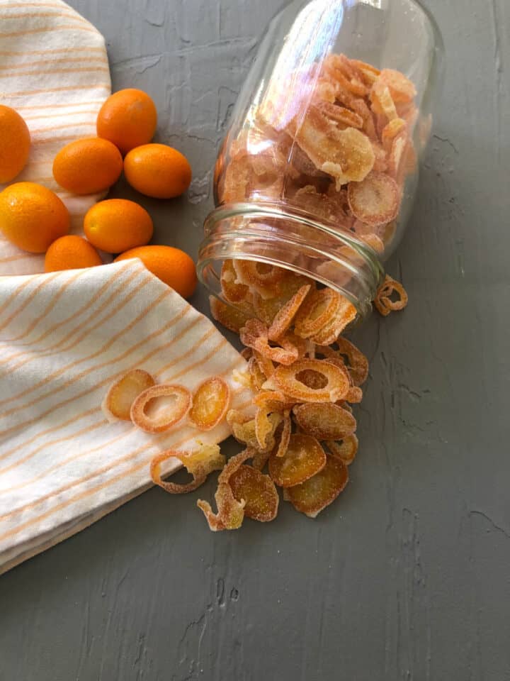 candied kumquats in a mason jar