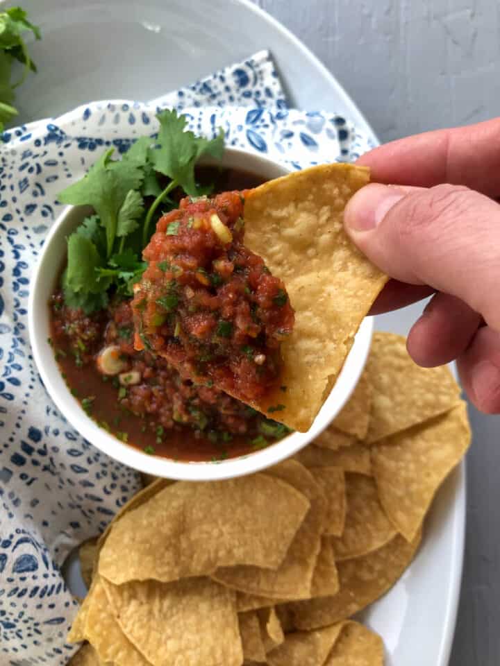 dipping a chip in salsa