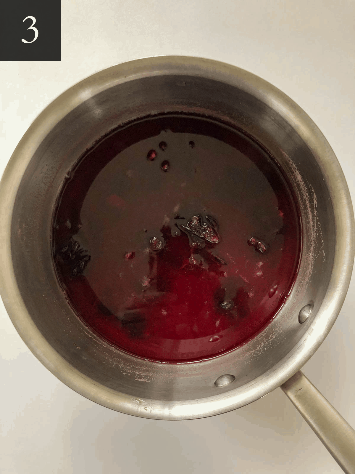 Steeping hibiscus flowers in a sauce pan.
