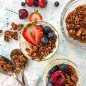 yogurt, granola, and berries in a mason jar