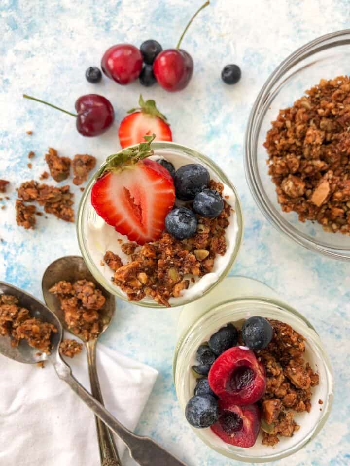 yogurt, granola, and berries in a mason jar