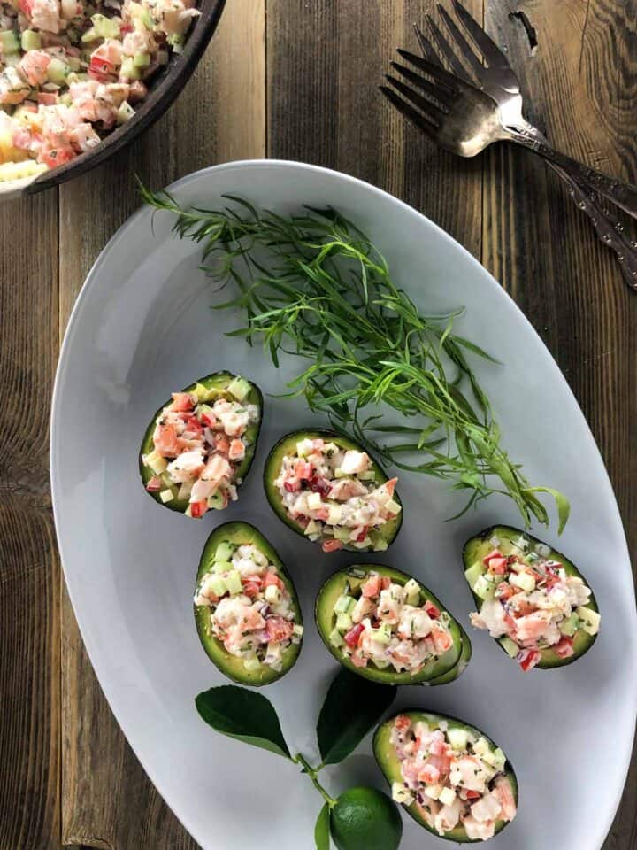 shrimp salad stuffed avocado on platter