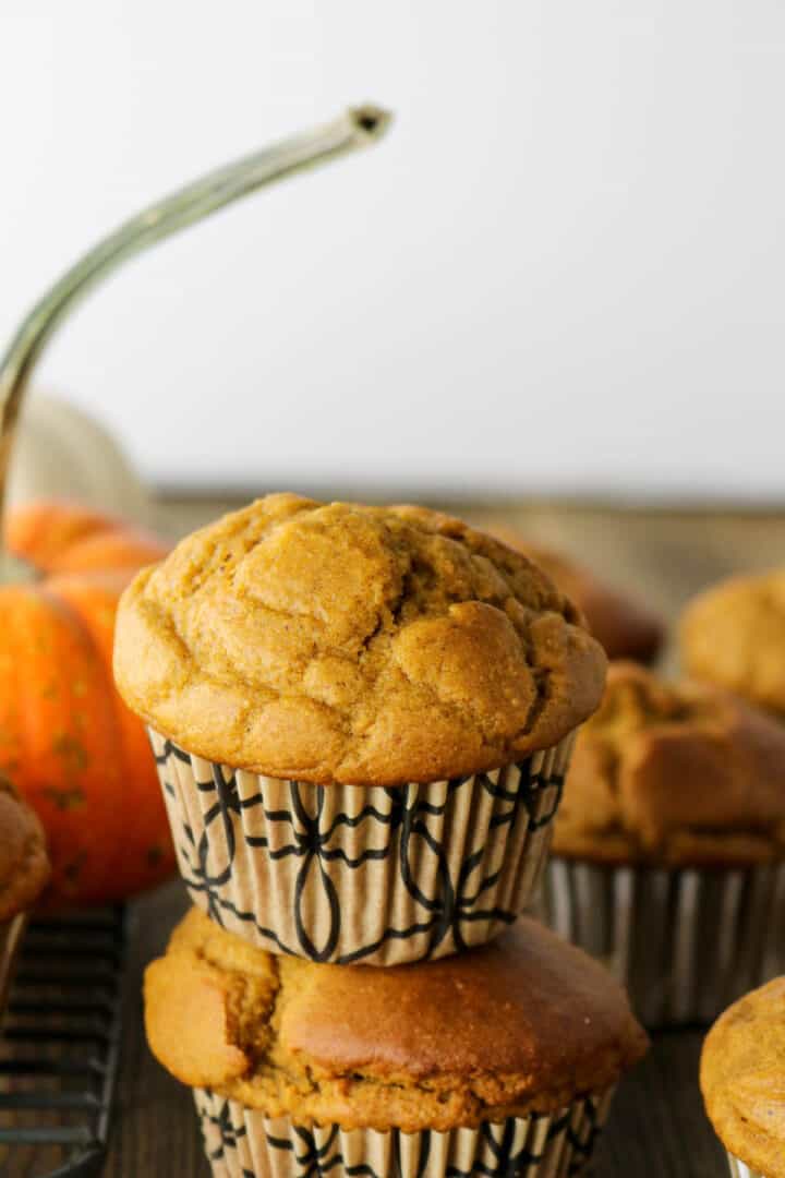 healthy pumpkin muffins stacked tall