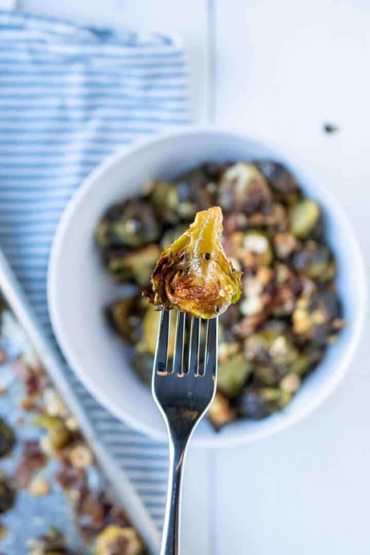 oven roasted brussels sprouts on a fork