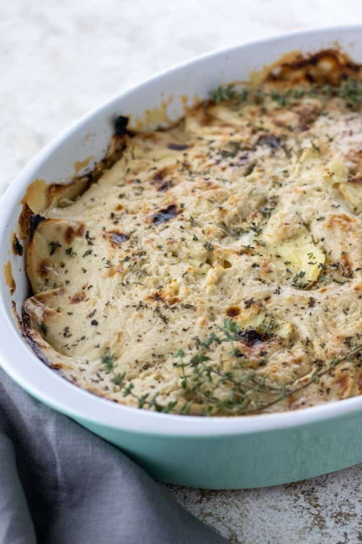 cranberry parsnip gratin with casserole dish angled