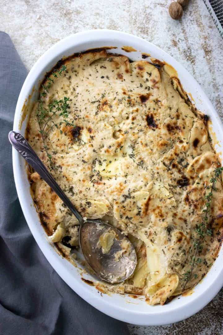cranberry parsnip gratin with a serving spoon