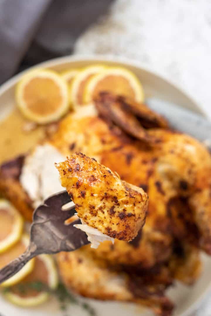crispy air fryer whole chicken on a dinner fork