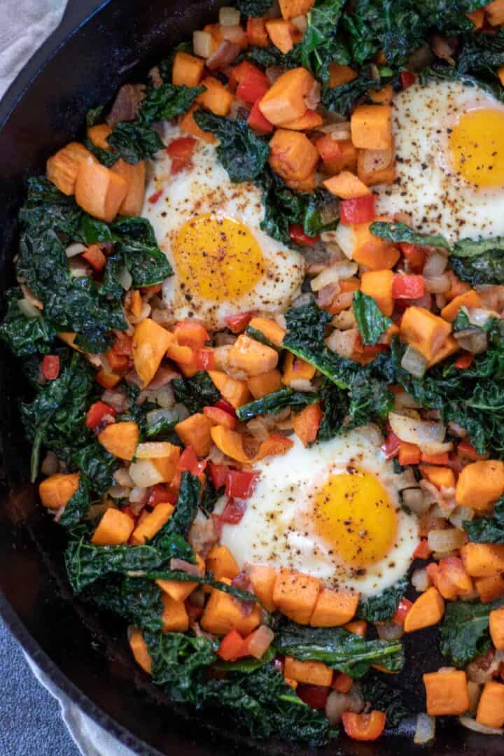 sweet potato hash with bacon and kale close up shot