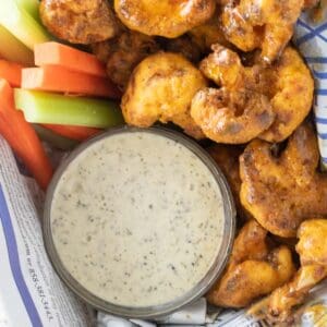 crispy air fried buffalo cauliflower with ranch dressing and vegetables
