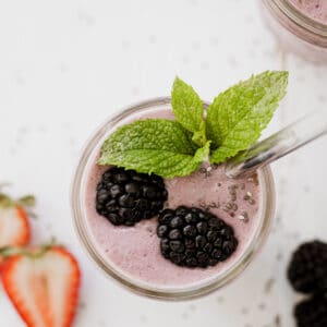 Berry smoothie in a mason jar.