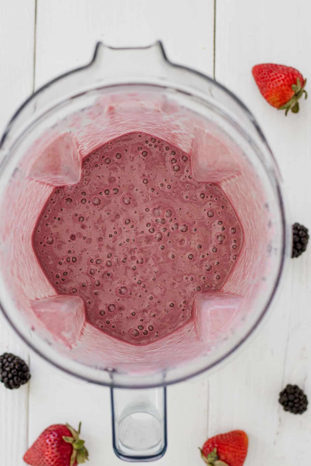 Blended blackberry, strawberry, and banana smoothie.