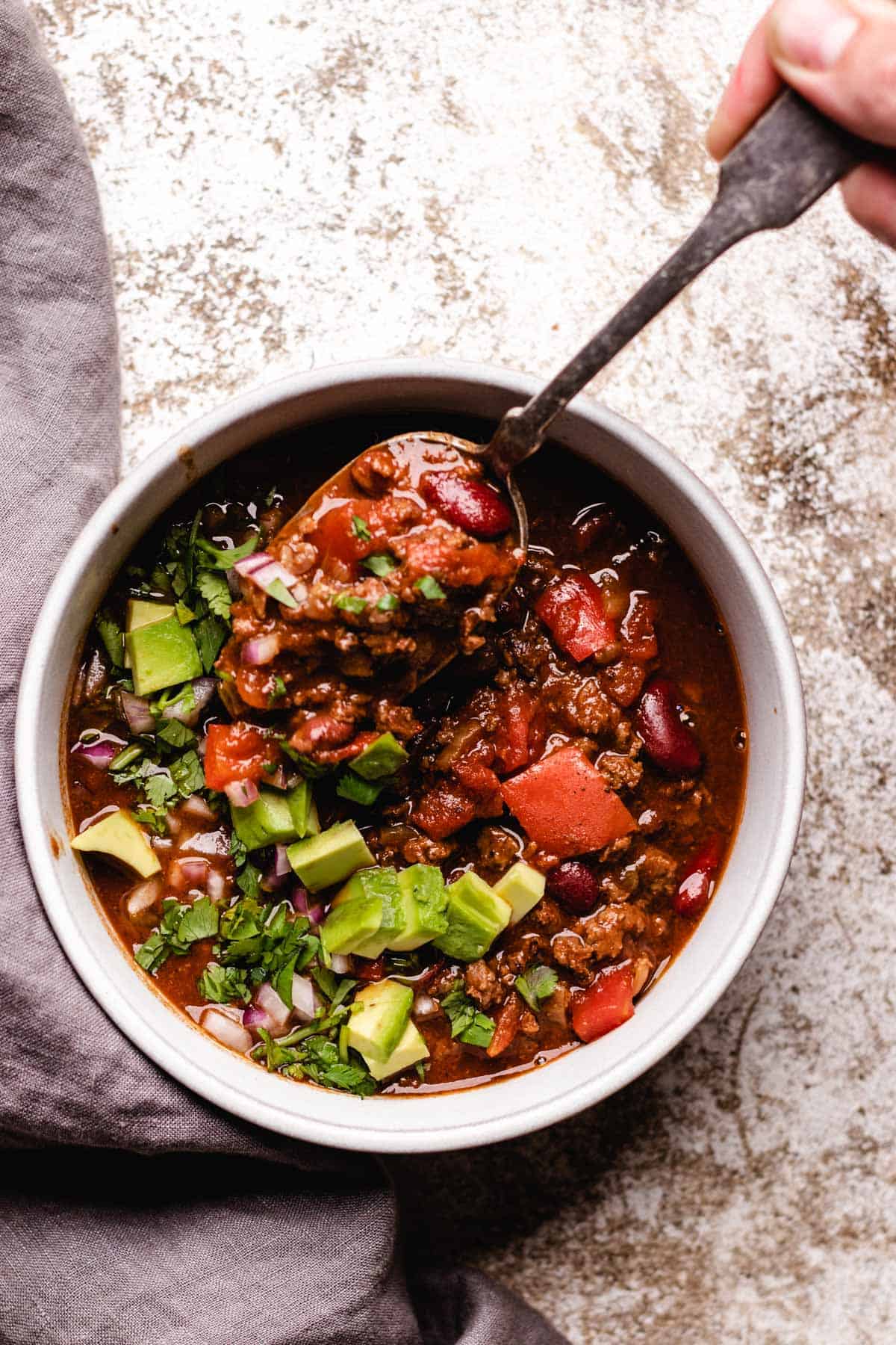 Deer chili with a spoon.