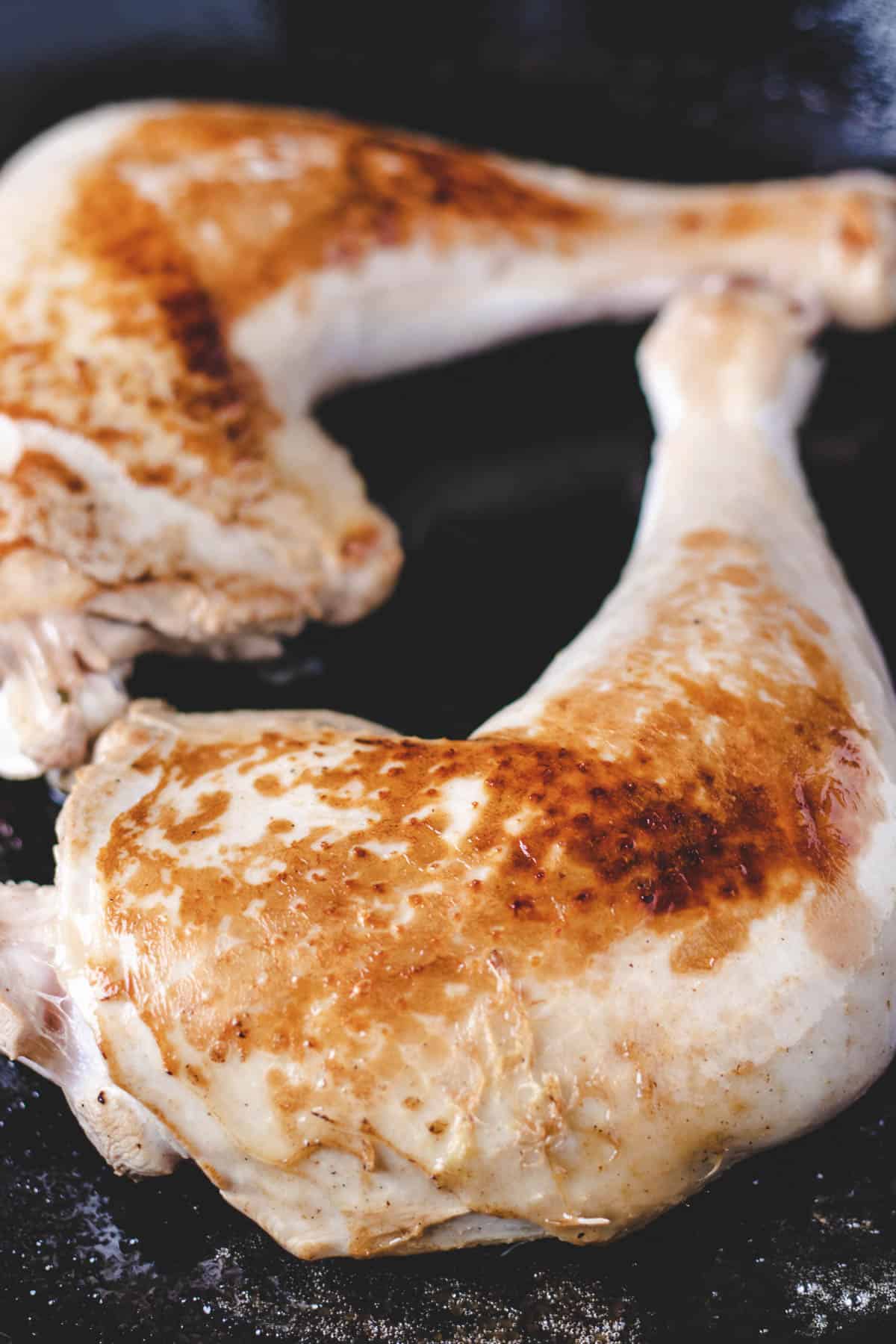 Searing turkey on a cast iron pan.