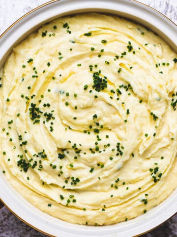 Mashed potatoes with chives on top.