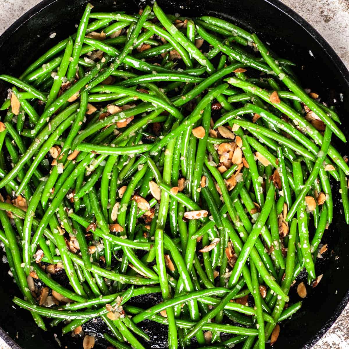 Green Beans with toasted almonds in a pan.