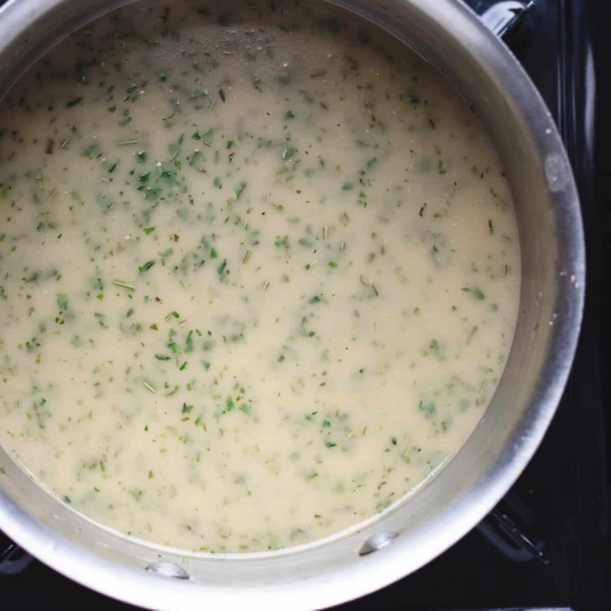 Turkey gravy in a saucepan.