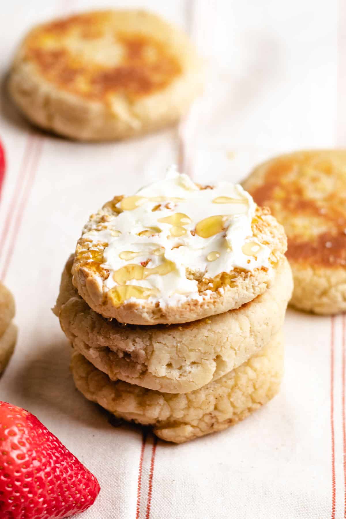 Toasted English muffin topped with butter and honey.