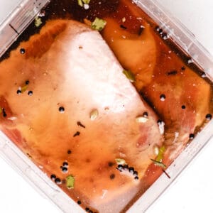 Featured image of corned beef brining in a solutions.