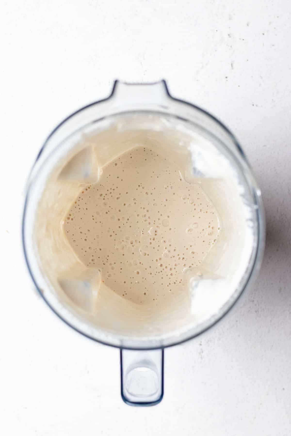 Photo of dairy-free crema in a blender.
