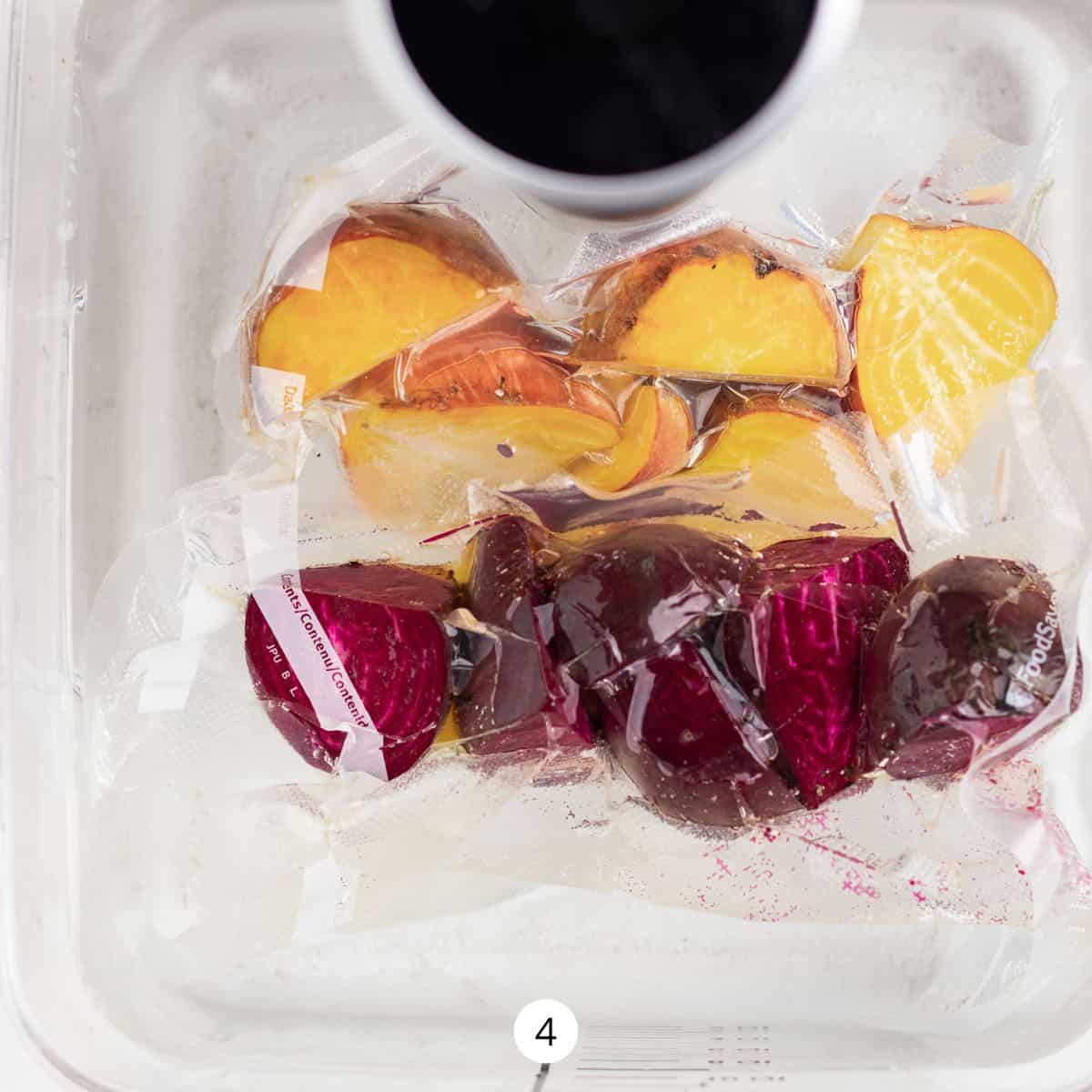 Vacuum sealed bag of red and yellow beets in a hot water bath.