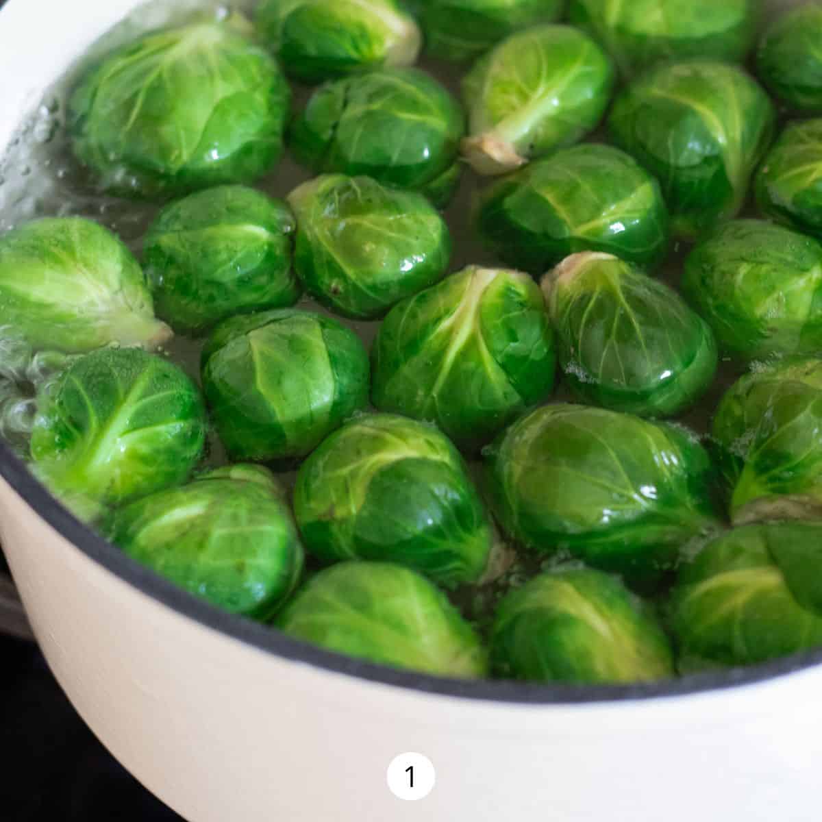 Boiling Brussels Sprouts in a large pot of water.