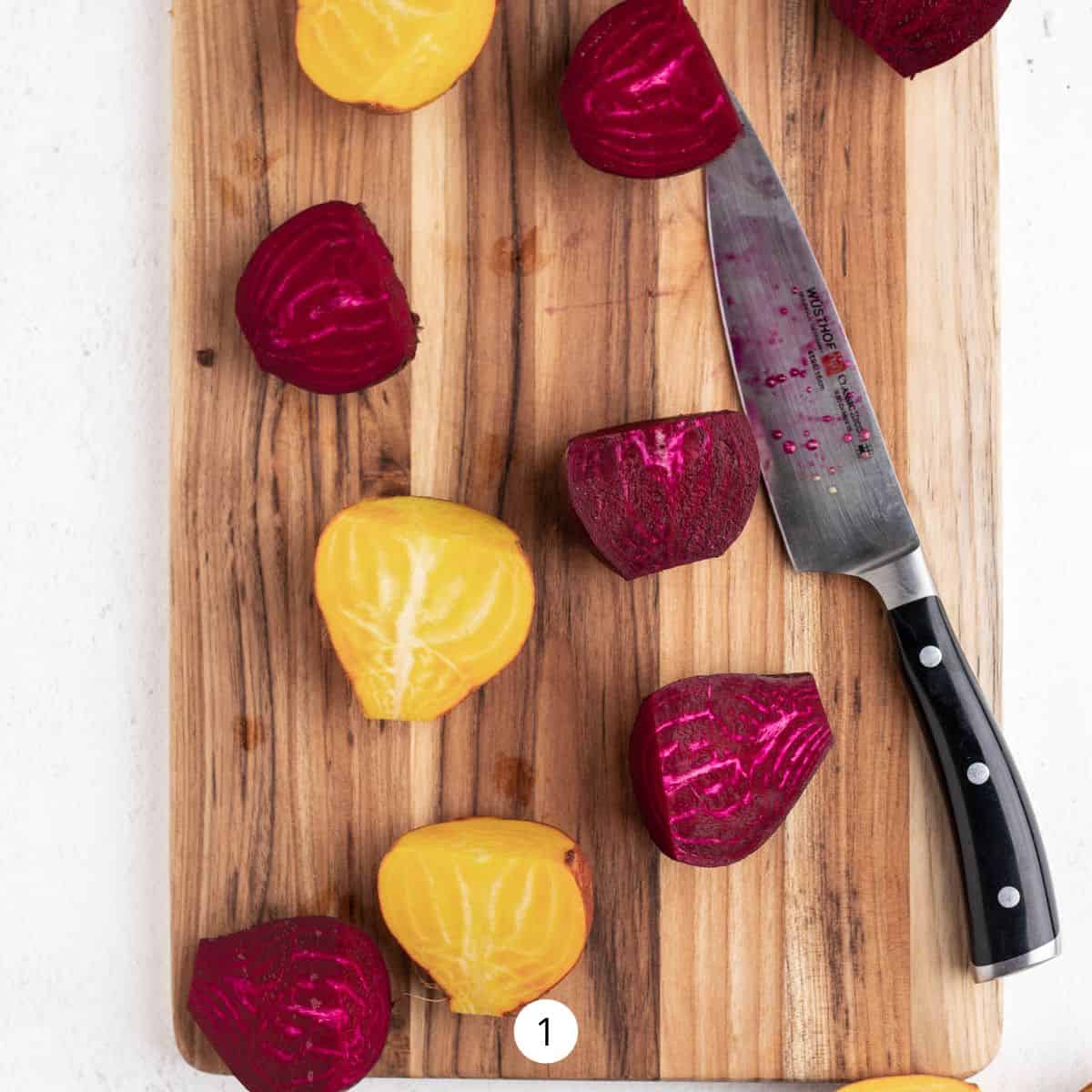 Cutting red and yellow beets in half lengthwise with a knife.