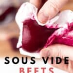 Peeling a red beet with a paper towel.