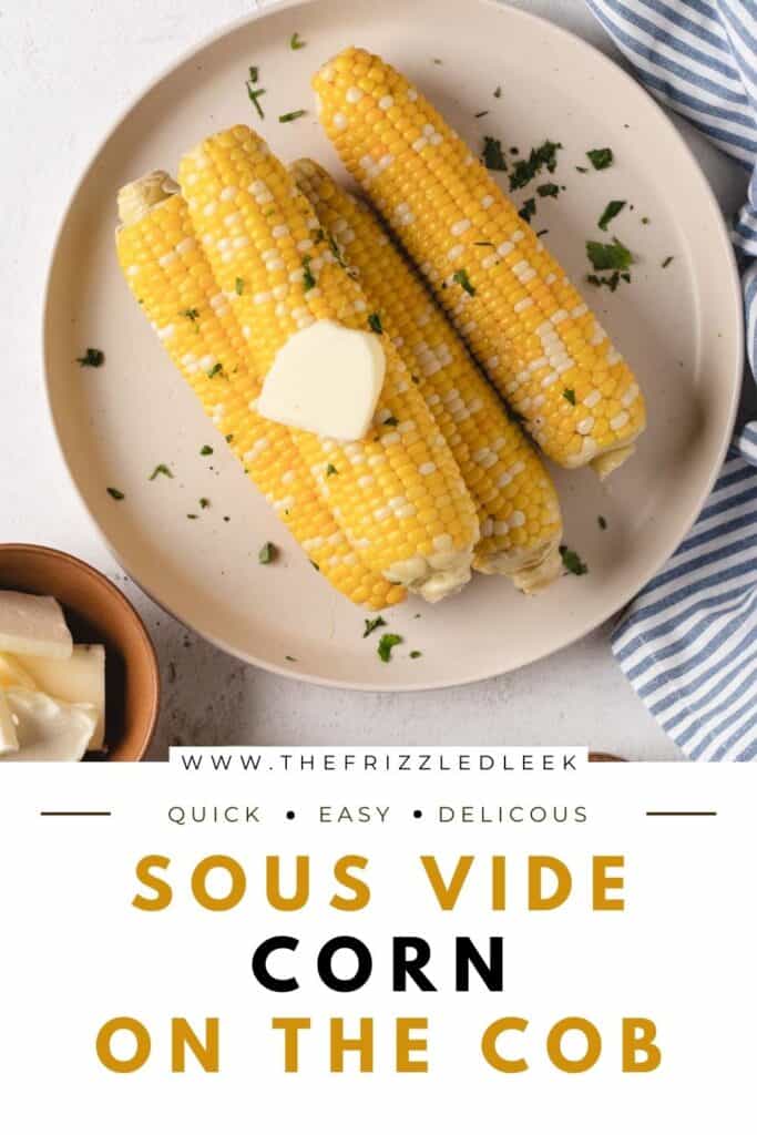 Fours ears of corn on the cob laying on a large round plate.