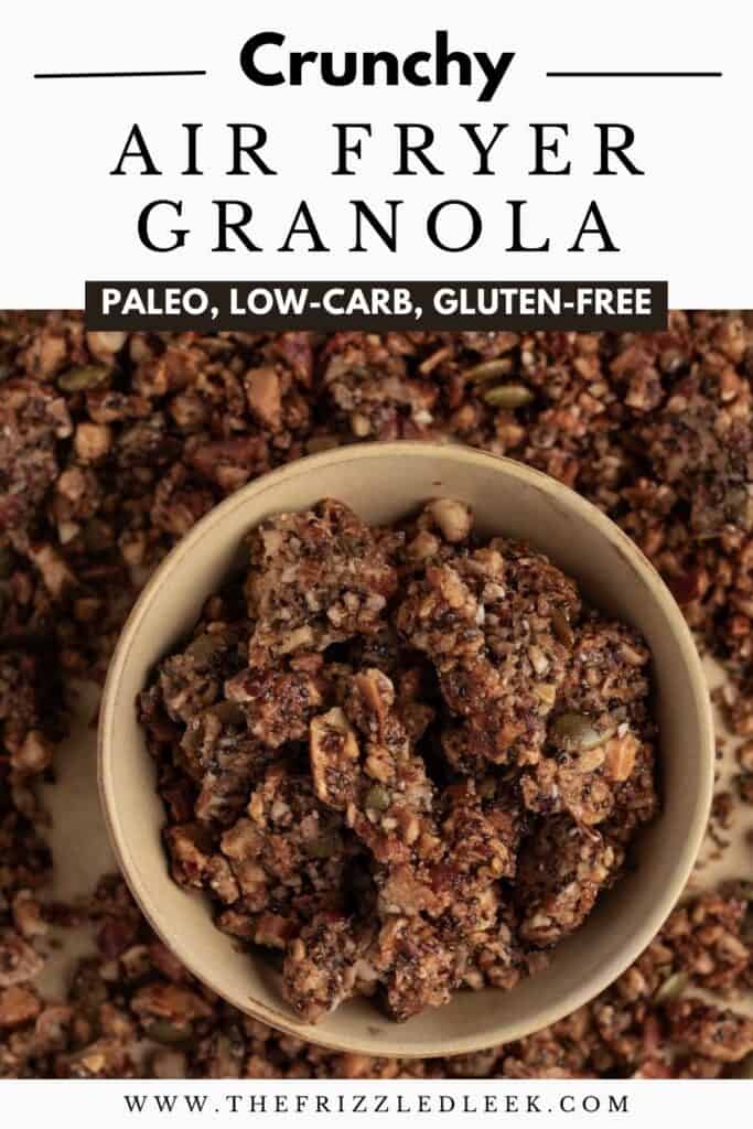 Granola made in an air fryer, displayed in a small round bowl with additional granola scattered around it.
