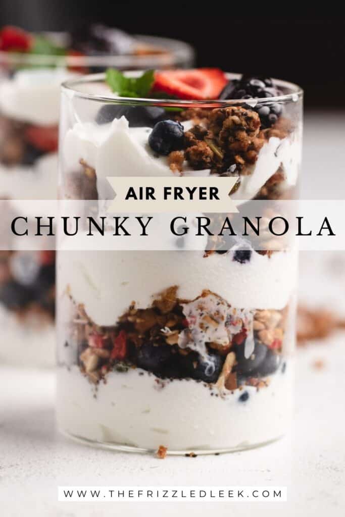 A yogurt parfait with air fryer granola inside of a glass jar.