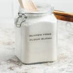 Flour thats in a glass flip-top jar and labeled Gluten-Free Flour Blend.