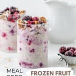 Two glass jars filled with overnight oats and topped with frozen berries and granola.