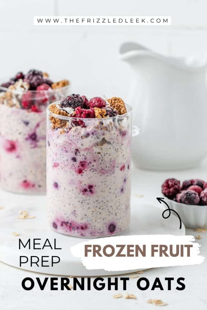 Two glass jars filled with overnight oats and topped with frozen berries and granola.