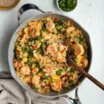 A large pan of cauliflower fried rice with shrimp.