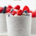 Chia pudding in a glass jar topped with fresh blueberries, raspberries, and coconut flakes.