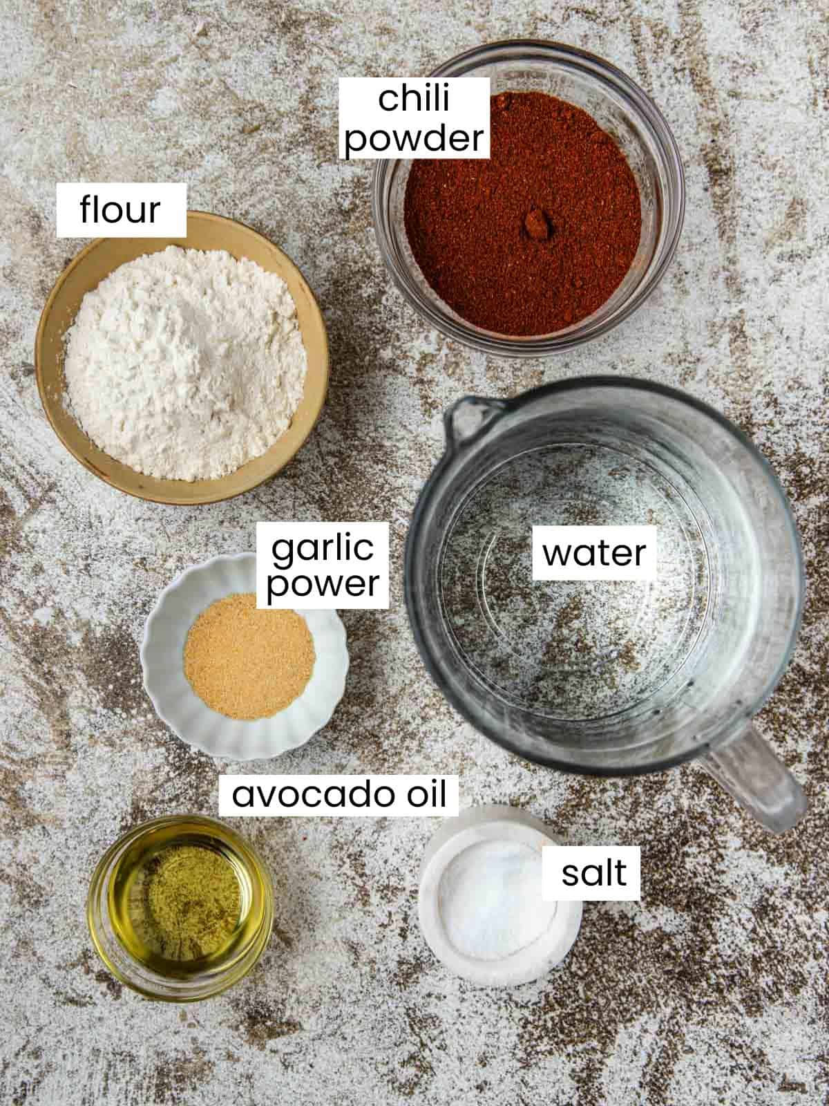 Chili powder, flour, garlic powder, water, avocado oil, and salt.