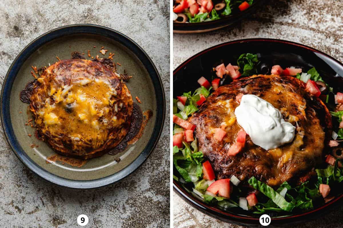 Presenting stacked beef enchiladas inside of a shallow bowl garnished with lettuce, tomatoes, olives, and sour cream.