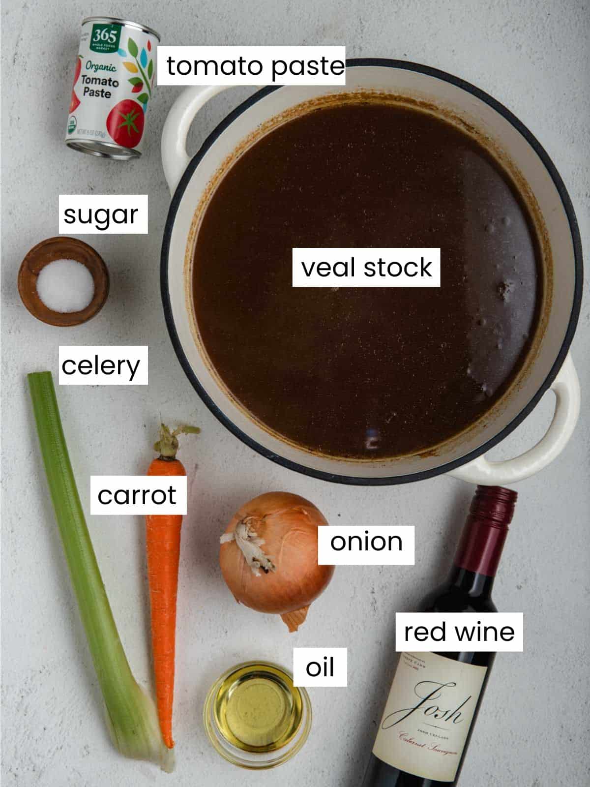 Veal stock, tomato paste, sugar, celery, carrot, onion, oil, and red wine.