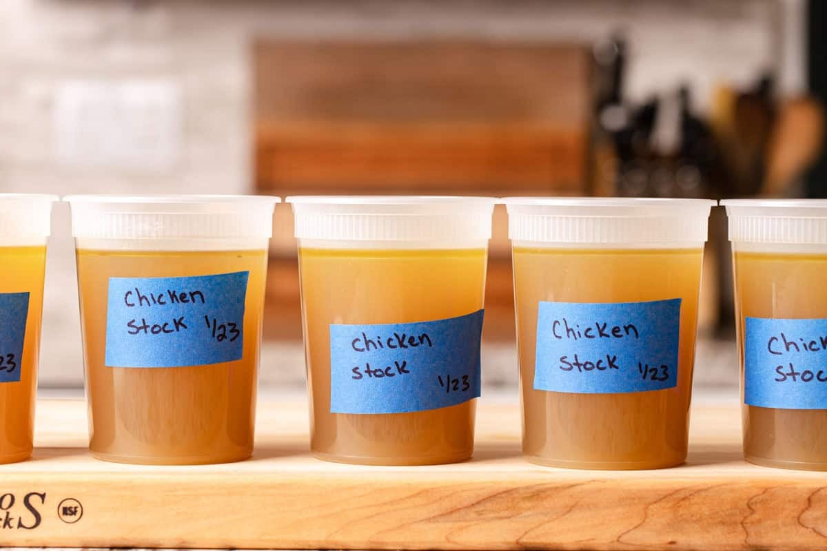 Chicken stock in five quart containers.