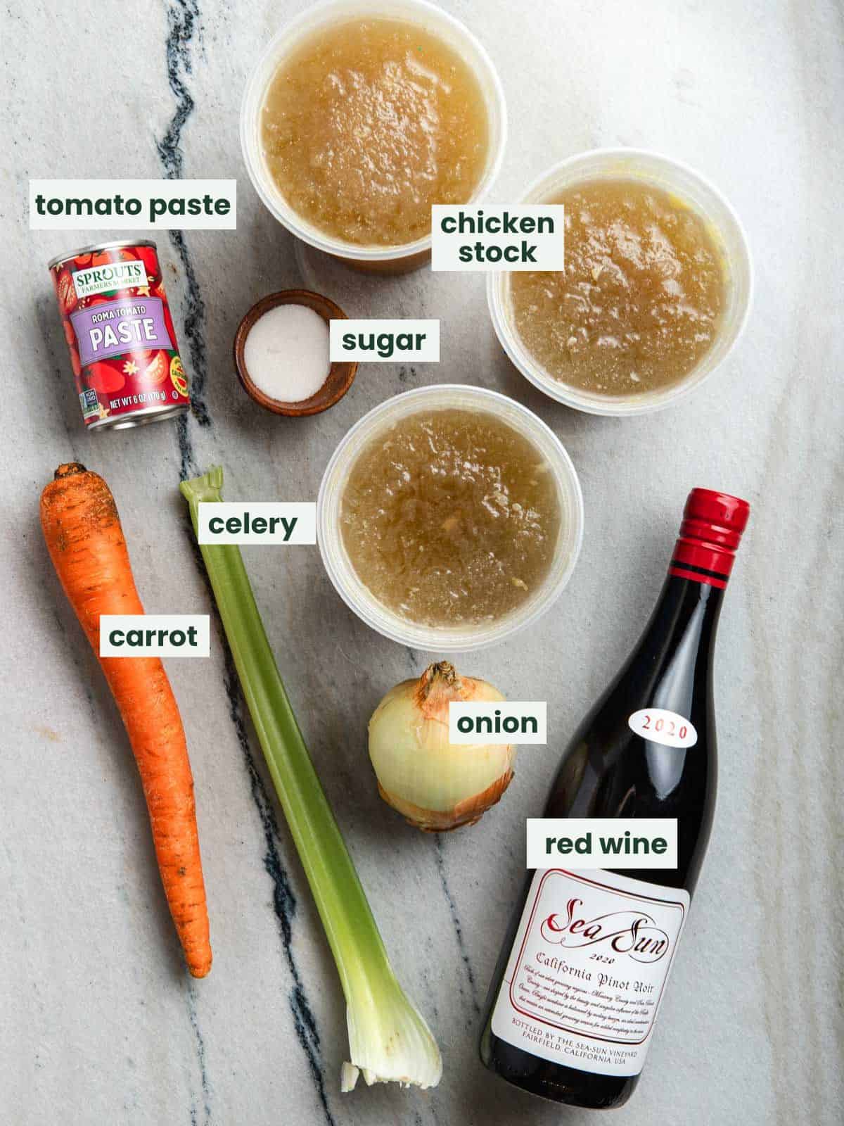 Chicken stock, tomato paste, sugar, carrot, celery, onion, and red wine.