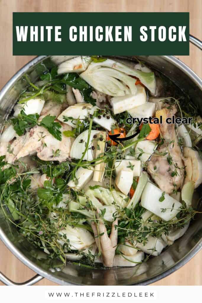 Chicken bones, vegetables, herbs, and cold water in a stainless steel stock pot.