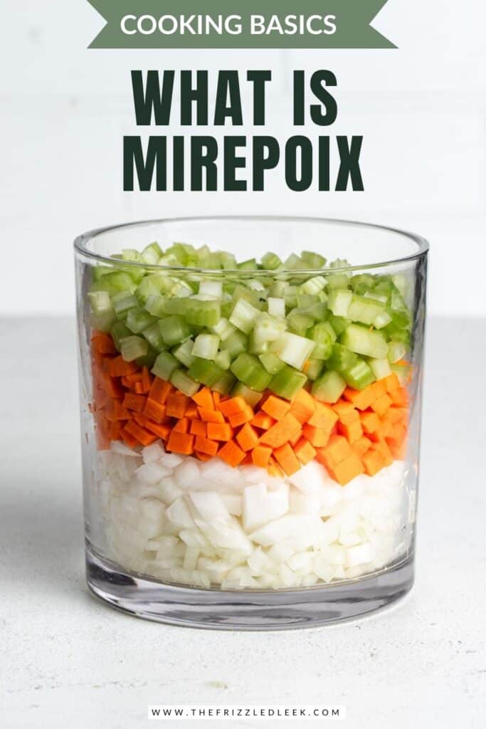 Onions, carrots, and celery layered in a large glass jar.